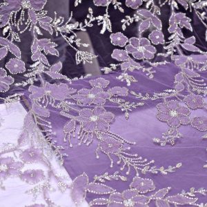 پارچه مجلسی گل حریر برجسته رنگ بنفش طرح سه
